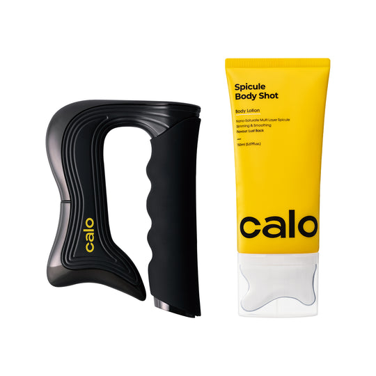 Black handheld device and yellow tube of 'calo' body lotion on a white background